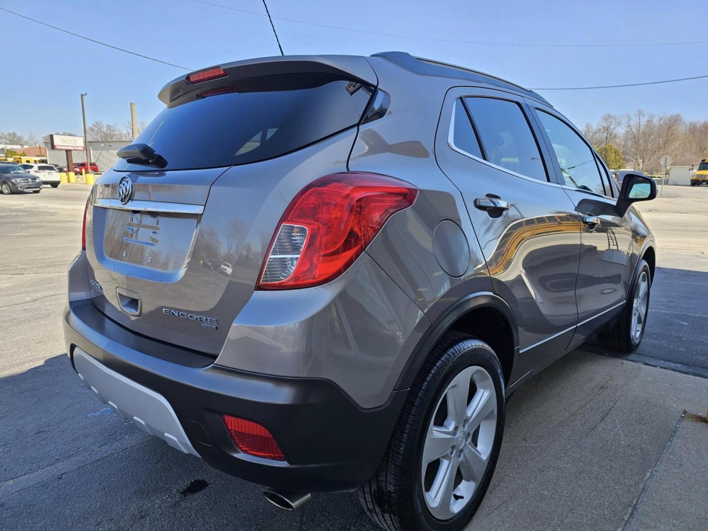 2015 GOLD Buick ENCORE LEATHER (KL4CJGSB8FB) with an Other engine, located at 502 South Main Street, Columbia City, IN, 46725, (260) 244-4645, 41.151382, -85.490578 - Discover the perfect blend of style, comfort, and versatility with the 2015 Buick Encore Leather, an SUV that's great for growing families and ideal for weekend adventures around Columbia City. Whether you're navigating the bustling streets of downtown or venturing into the beautiful Indiana country - Photo#2