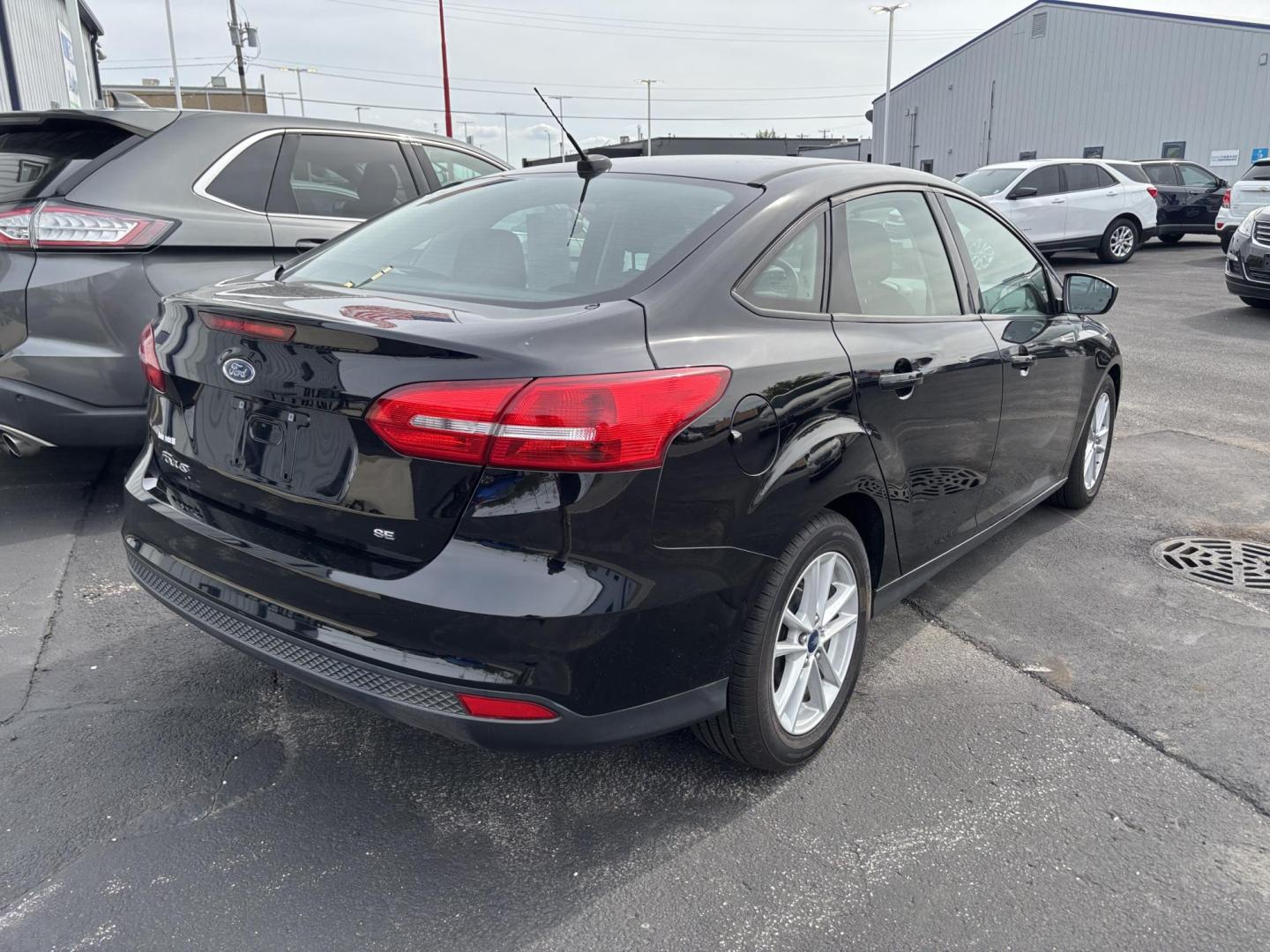 2018 BLACK Ford FOCUS SE (1FADP3F28JL) with an Other engine, located at 100 West Coliseum Boulevard, Fort Wayne, IN, 46805, (260) 471-0567, 41.119961, -85.140312 - **Discover Your Next Adventure with the 2018 Ford Focus SE at Auto Credit in Fort Wayne, IN!**<br /> <br /> Are you ready to elevate your daily commute or embark on weekend adventures? Look no further than the stunning 2018 Ford Focus SE, available now at Auto Credit, your trusted Buy Here Pay Here - Photo#2