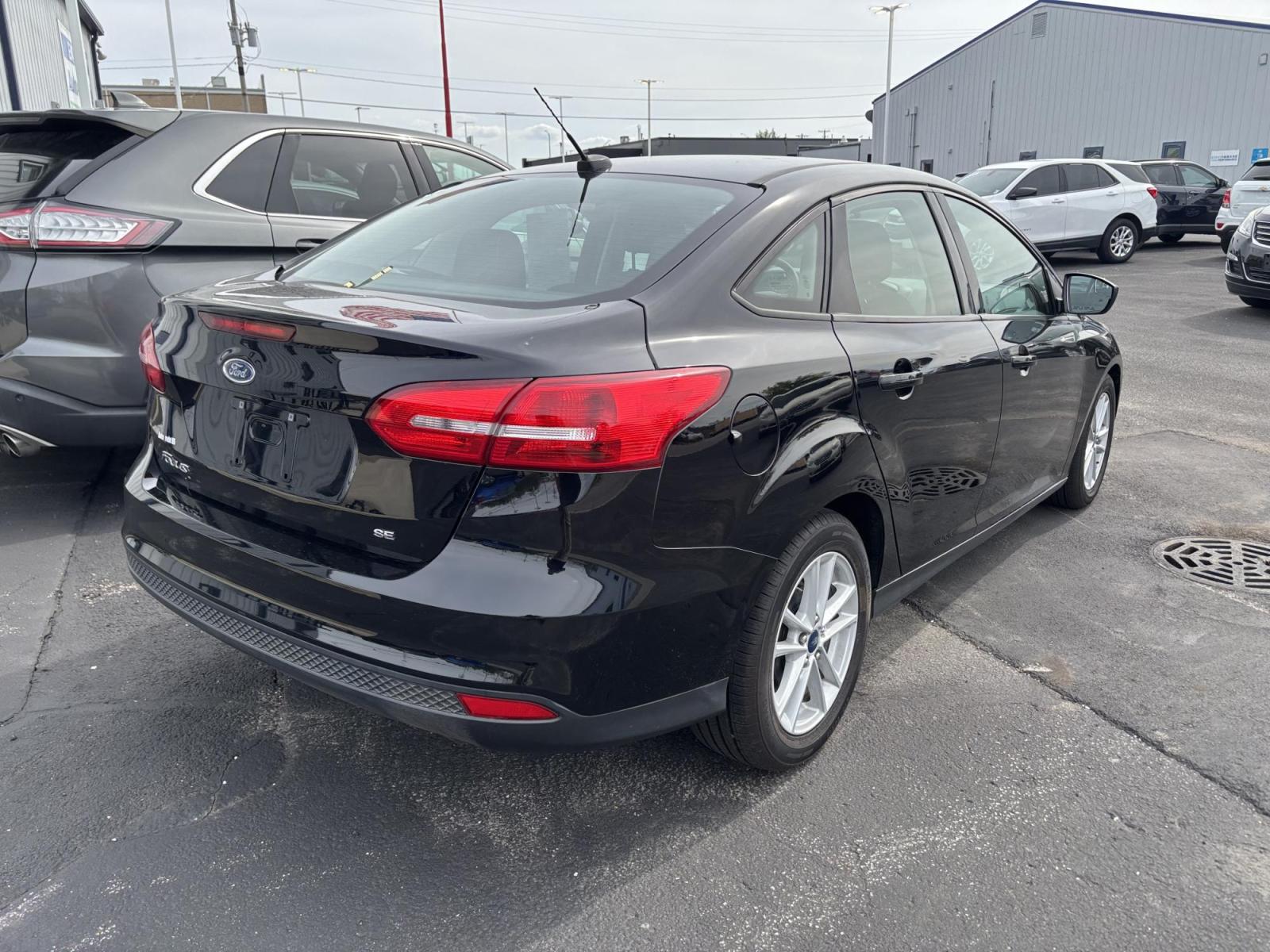 2018 BLACK Ford FOCUS SE (1FADP3F28JL) with an Other engine, located at 100 West Coliseum Boulevard, Fort Wayne, IN, 46805, (260) 471-0567, 41.119961, -85.140312 - 2018 Ford FOCUS SE - Photo#2