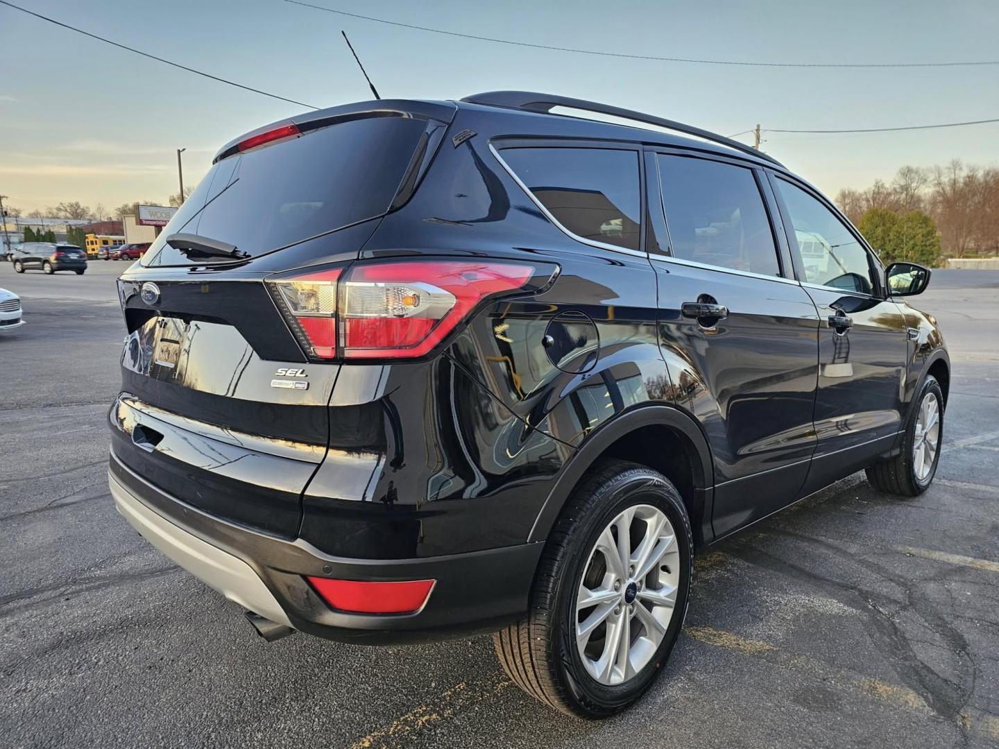 2018 BLACK /black Ford Escape SEL 4WD (1FMCU9HD1JU) with an 1.5L L4 DOHC 16V engine, 6A transmission, located at 502 South Main Street, Columbia City, IN, 46725, (260) 244-4645, 41.151382, -85.490578 - Photo#2