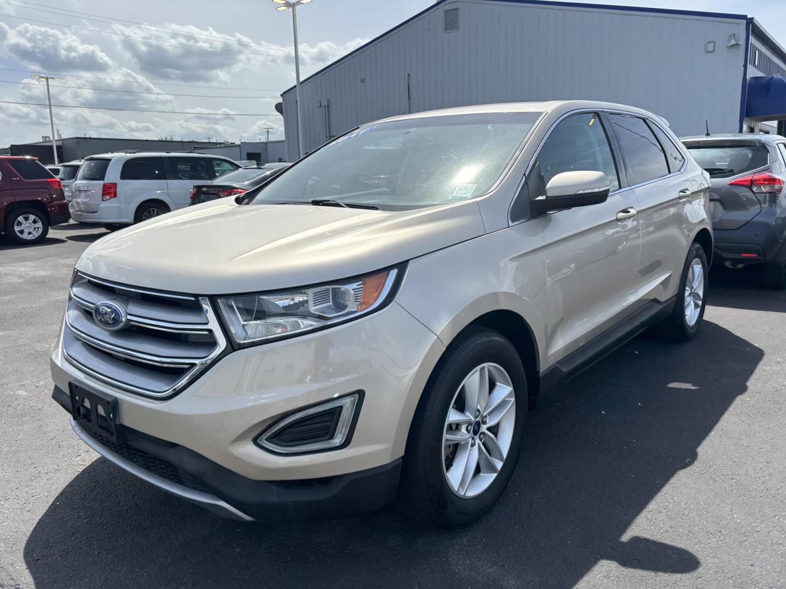 2017 GOLD Ford EDGE SEL (2FMPK3J93HB) with an Other engine, located at 100 West Coliseum Boulevard, Fort Wayne, IN, 46805, (260) 471-0567, 41.119961, -85.140312 - 2017 Ford EDGE SEL - Photo#1