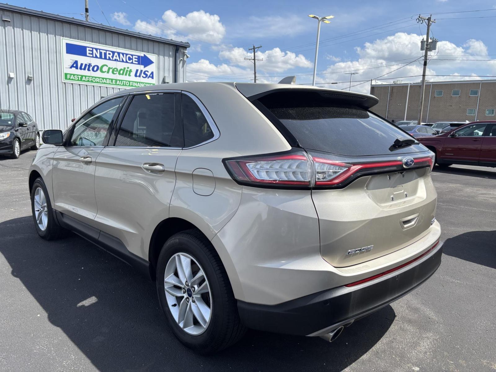 2017 GOLD Ford EDGE SEL (2FMPK3J93HB) with an Other engine, located at 100 West Coliseum Boulevard, Fort Wayne, IN, 46805, (260) 471-0567, 41.119961, -85.140312 - 2017 Ford EDGE SEL - Photo#2