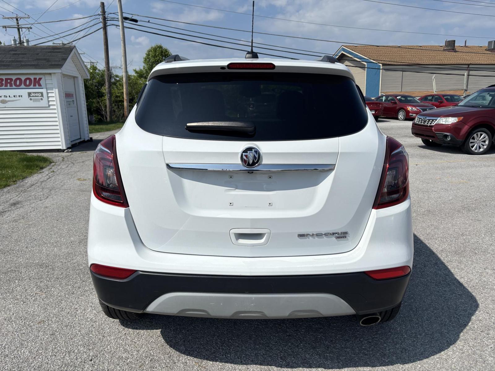 2019 WHITE /black Buick Encore Essence AWD (KL4CJGSMXKB) with an 1.4L L4 DOHC 16V TURBO engine, 6A transmission, located at 100 West Coliseum Boulevard, Fort Wayne, IN, 46805, (260) 471-0567, 41.119961, -85.140312 - Photo#6