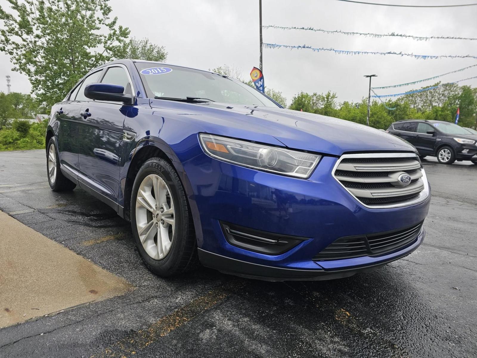 2015 BLUE /BLACK Ford Taurus SEL AWD (1FAHP2H86FG) with an 3.5L V6 DOHC 24V engine, 6-Speed Automatic transmission, located at 502 South Main Street, Columbia City, IN, 46725, (260) 244-4645, 41.151382, -85.490578 - Photo#1