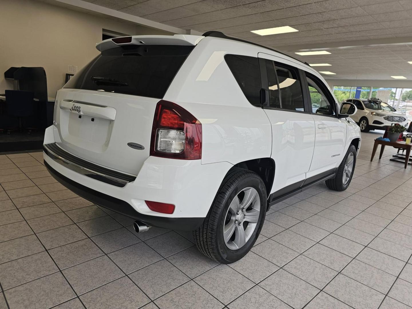 2016 WHITE Jeep Compass (1C4NJDEB9GD) with an Other engine, located at 502 South Main Street, Columbia City, IN, 46725, (260) 244-4645, 41.151382, -85.490578 - **Adventure Awaits with the 2016 Jeep Compass Latitude Perfect for Your Next Journey!**<br /> <br /> Are you ready to embrace life's adventures? Whether you're exploring the scenic roads of Columbia City, IN, or planning a weekend getaway to the nearby Indiana Dunes, the 2016 Jeep Compass Latitude - Photo#2