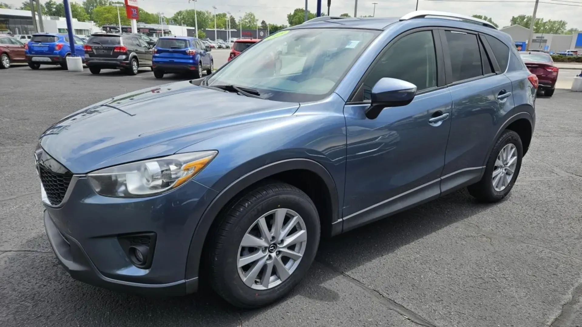 2015 Mazda CX-5 TOURING (JM3KE2CY0F0) with an Other engine, located at 5744 Central Avenue, Toledo, OH, 43615, (419) 724-0130, 41.676781, -83.682137 - **Discover Your Adventure with the 2015 Mazda CX-5 Touring at Auto Credit in Toledo, OH!**<br /> <br /> Are you ready to elevate your family outings or weekend adventures? The 2015 Mazda CX-5 Touring is the perfect blend of versatility and comfort, designed to meet the needs of today's active lifest - Photo#1