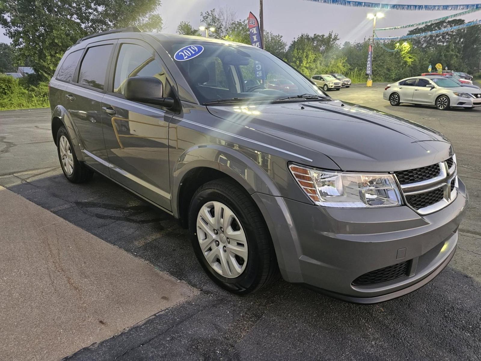 2019 GRAY Dodge Journey (3C4PDCAB4KT) with an Other engine, located at 502 South Main Street, Columbia City, IN, 46725, (260) 244-4645, 41.151382, -85.490578 - **Embark on Your Next Adventure with the 2019 Dodge Journey SE!**<br /> <br /> Are you ready to elevate your family outings or weekend getaways? The 2019 Dodge Journey SE is the perfect companion for those who crave the versatility of an SUV while enjoying the comforts of a spacious interior. Whethe - Photo#1