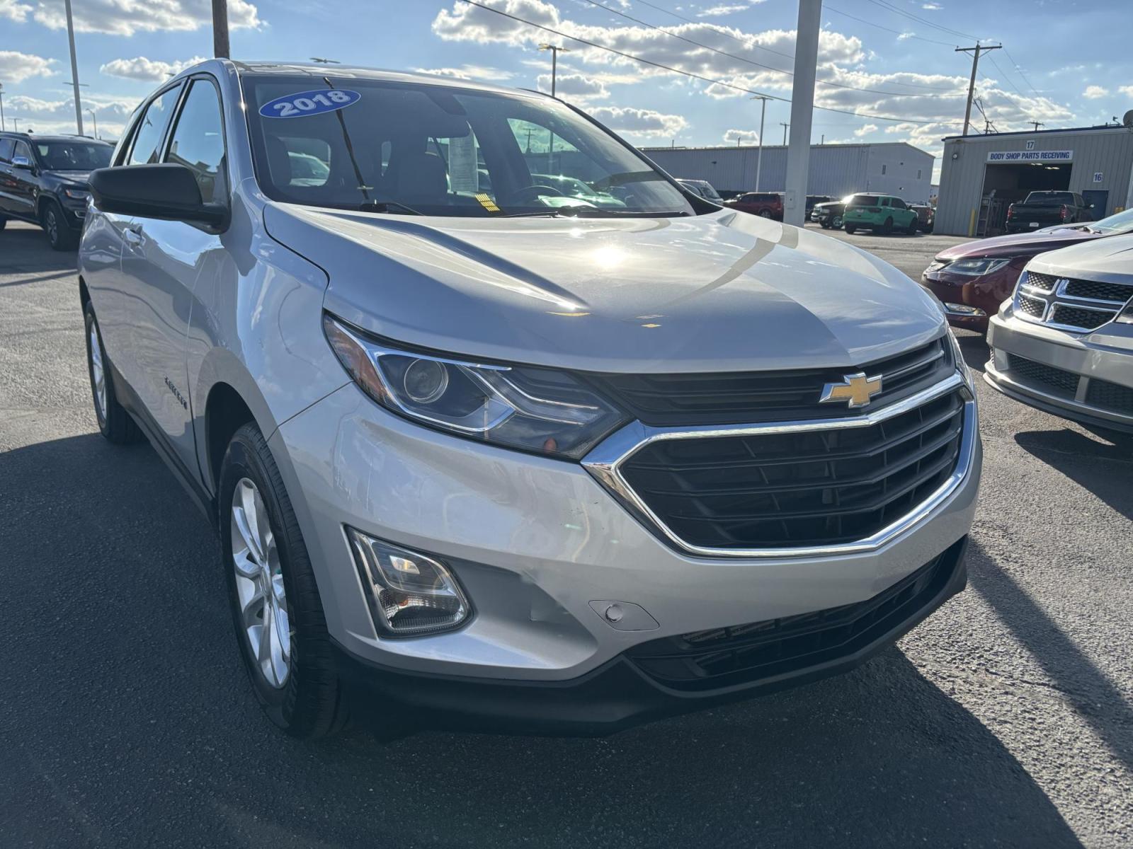 2018 SILVER Chevrolet EQUINOX LS (2GNAXHEV7J6) with an Other engine, located at 100 West Coliseum Boulevard, Fort Wayne, IN, 46805, (260) 471-0567, 41.119961, -85.140312 - Are you ready to elevate your daily commute or embark on your next family adventure? Discover the perfect blend of style, comfort, and reliability with this stunning 2018 Chevrolet Equinox LS. Whether you're shuttling kids around town, heading to work, or planning that weekend getaway, this versatil - Photo#0